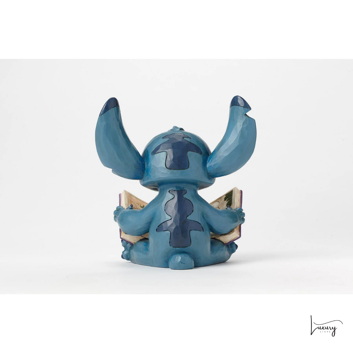 Disney Tradition Figurina Stitch con libro